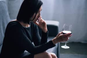 woman with alcohol addiction - habit vs addiction