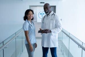 Two medical professionals getting ready for a medically-induced drug detox for their patient