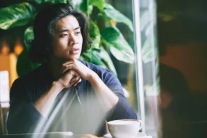 Man suffering from unresolved trauma and addiction